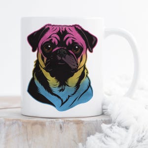 May include: White ceramic mug featuring a colorful illustration of a pug dog. The pug's head is colored with pink, yellow, and blue hues. The mug has a white handle and is set against a neutral background.