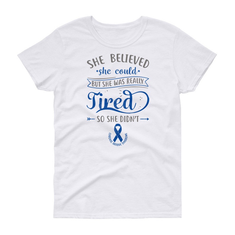 May include: White t-shirt with a blue ribbon and the text "SHE BELIEVED she could BUT SHE WAS REALLY Tired SO SHE DIDN'T" with arrows pointing to the left and right of the text.