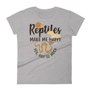 May include: Gray t-shirt with the text "Reptiles make me happy, you not so much" in brown lettering. The shirt features a cartoon turtle, lizard, and snake.