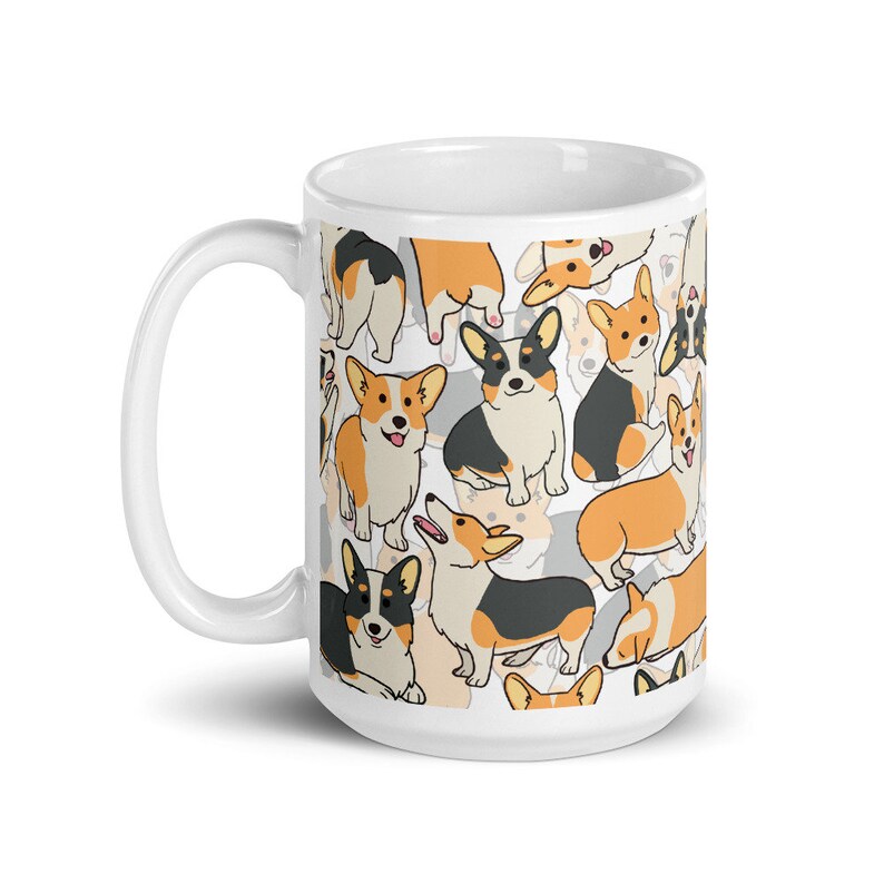May include: White ceramic mug with a pattern of cartoon corgis in black, orange, and white. The corgis are in various poses, some are looking at the viewer, some are looking away, and some are sitting, standing, or running.