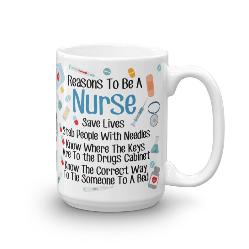 May include: White ceramic coffee mug with a blue and red design. The mug features the text "Reasons To Be A Nurse" and a list of reasons, including "Save Lives", "Stab People With Needles", "Know Where The Keys Are To The Drugs Cabinet", and "Know The Correct Way To Tie Someone To A Bed".