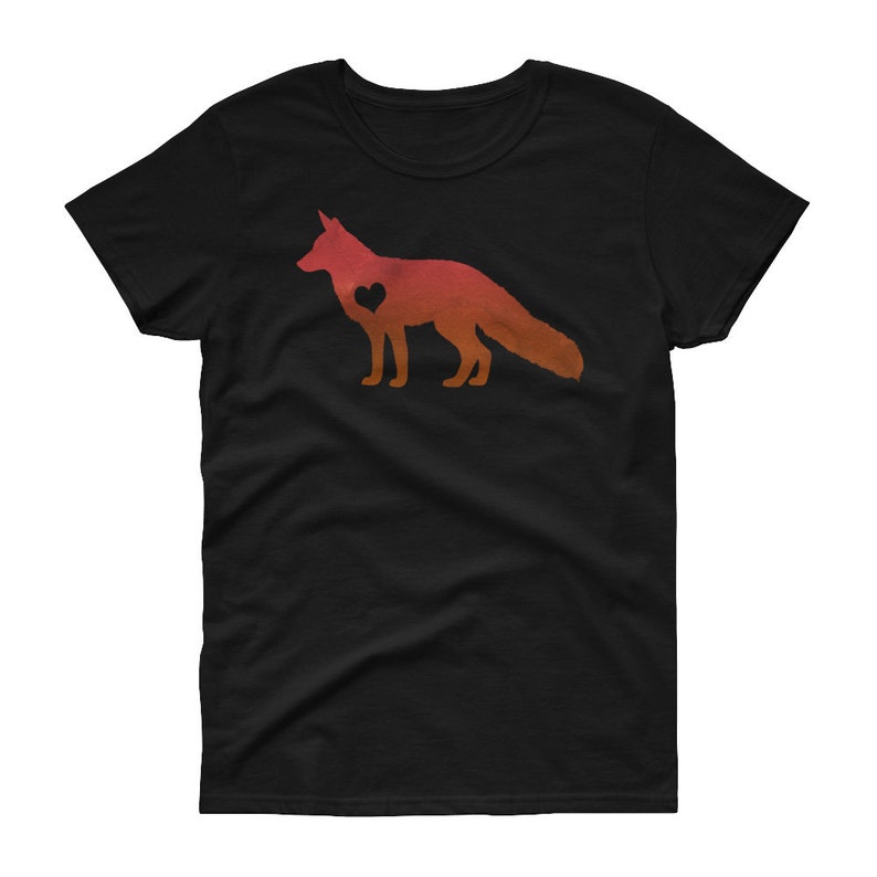 May include: A black t-shirt with a red and orange silhouette of a fox with a heart inside. The fox is facing the right side of the image.