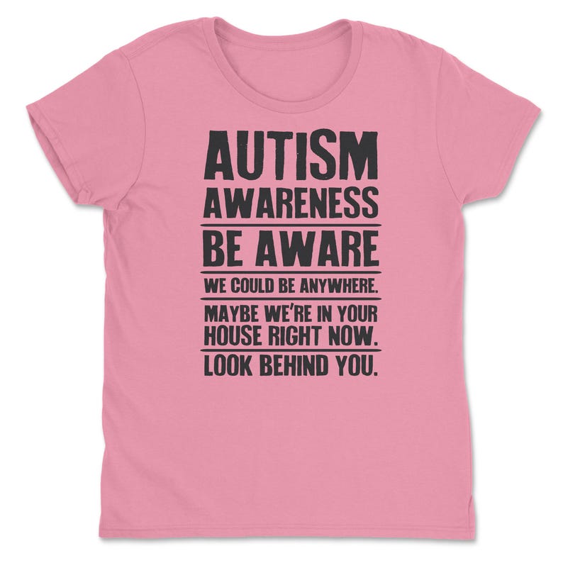 a pink t - shirt with the words autism awareness be aware