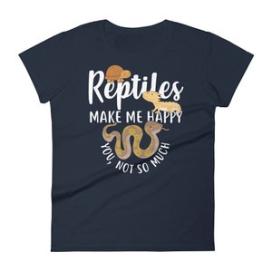 May include: A navy blue t-shirt with a white graphic that says "Reptiles make me happy, you not so much". The graphic includes a cartoon turtle, a bearded dragon, and a snake.