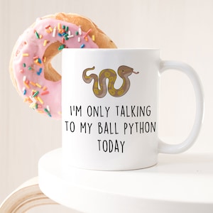 May include: White ceramic coffee mug with a brown snake illustration and the text "I'm only talking to my ball python today".
