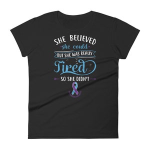 May include: Black women's t-shirt with a blue and purple ribbon and the text "She believed she could, but she was really tired so she didn't."