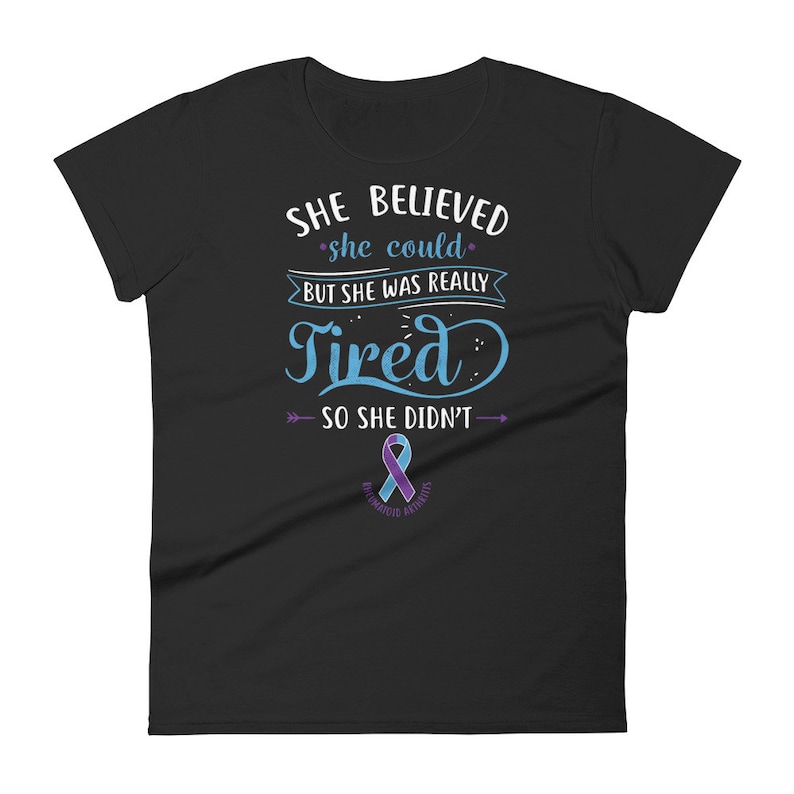 May include: Black women's t-shirt with a blue and purple ribbon and the text "She believed she could, but she was really tired so she didn't."