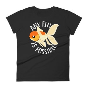 May include: Black women's t-shirt with a white goldfish illustration and the text "Any Fin Is Possible".