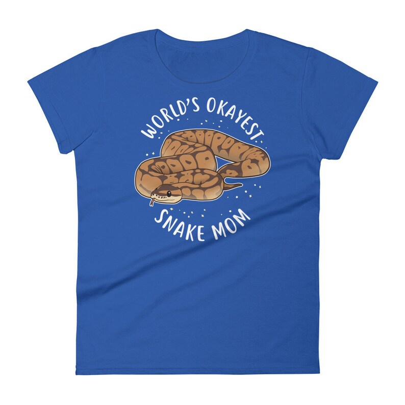 May include: A royal blue t-shirt with a white circle design featuring a cartoon snake and the text "World's Okayest Snake Mom".