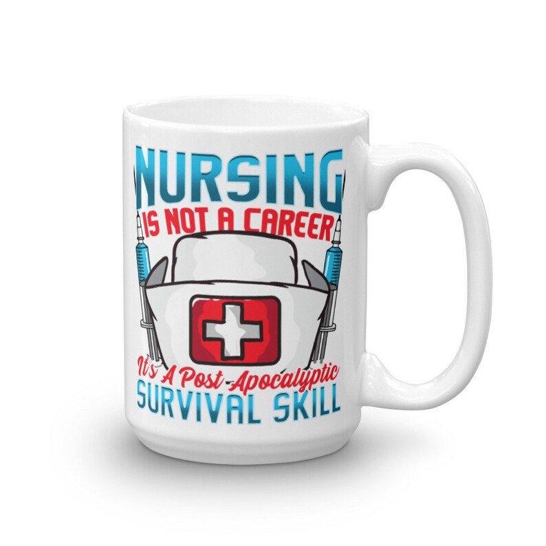 May include: White ceramic mug with a red cross and the text "Nursing is not a career it's a post-apocalyptic survival skill" printed on it.
