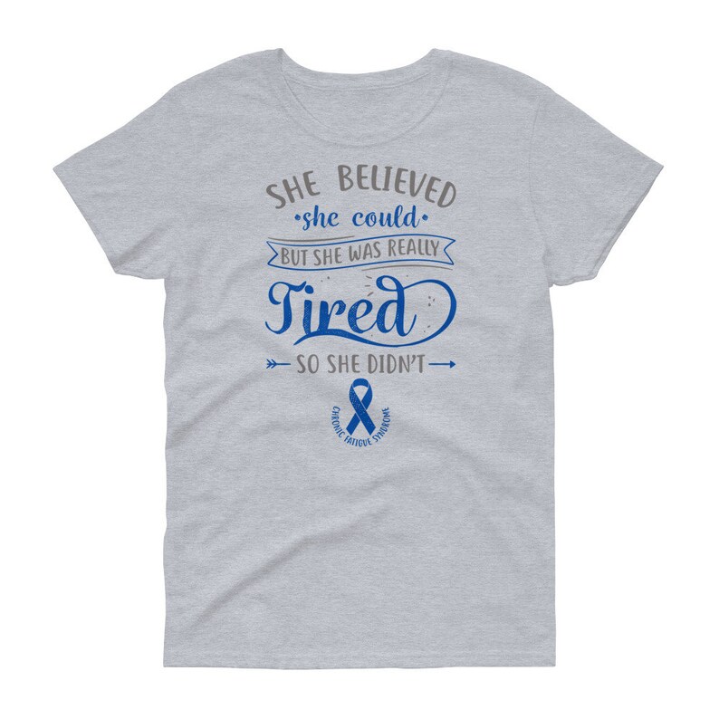 May include: Gray t-shirt with a blue ribbon and the text "SHE BELIEVED she could. BUT SHE WAS REALLY Tired SO SHE DIDN'T" with arrows pointing to the left and right of the text.