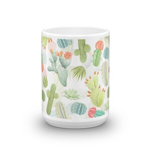 May include: White ceramic mug with a colorful cactus pattern. The mug features a variety of cacti in shades of green, pink, and orange.
