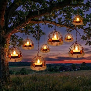 May include: Several hanging candle lanterns suspended from a tree branch. Each lantern has a metal cage design, a candle, and a decorative base. The scene is set at dusk with a colorful sunset in the background, creating a warm and inviting ambiance.