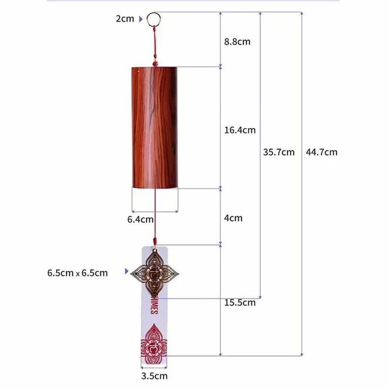 May include: A wooden wind chime with a cylindrical body and a decorative metal piece. The chime is 17.6 inches long overall, with a 6.5 cm x 6.5 cm decorative piece. The cylindrical body is 6.4 cm wide and 16.4 cm long. The chime has the word "CHIMES" on it.
