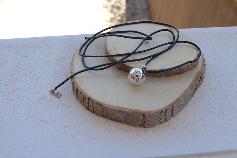 silver plated smooth hand cage pendant