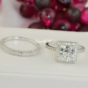 May include: A set of two silver wedding bands with a square-shaped diamond ring and a band with two rows of small diamonds.