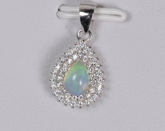 Anillo de plata de ley 925 con ópalo etíope natural en forma de lágrima y doble halo.