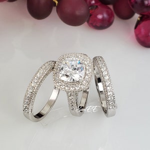 Three pieces Women’s Cushion Cut Ring set
*Approximate total carat weight 4.35ct
*base is real .925 sterling silver with Rhodium Plating
*Stone: Flawless D Color Simulated Diamond