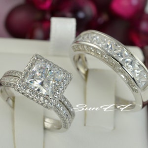 Three pieces total Men and Women’s Wedding Ring Set
*Two pieces Women’s Halo Princess Cut Ring set
*Approximate total carat weight 4.30ct
*base is real .925 sterling silver with Rhodium Plating
*Stone: Flawless D Color Simulated Diamond