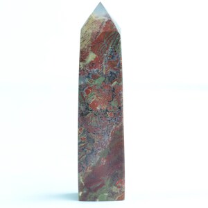 May include: A tall, pointed, red, green, and brown jasper crystal tower.