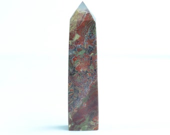 May include: A tall, pointed, red, green, and brown jasper crystal tower.