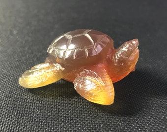 TURTLE - carved from Blue natural AMBER from Indonesia - Sumatra - hand made - absolutely and unique - polished - orange-bronze colored 10 g