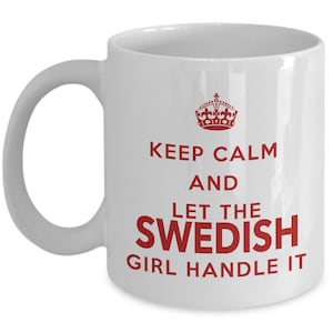 May include: White ceramic coffee mug with a red crown and the text "Keep Calm and Let the Swedish Girl Handle It."