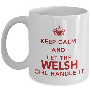 May include: White ceramic coffee mug with a red crown and the text "Keep Calm and Let the Welsh Girl Handle It."