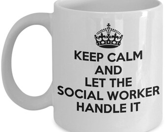 May include: White ceramic coffee mug with a black and white design. The design features a crown and the text "Keep Calm and Let the Social Worker Handle It."