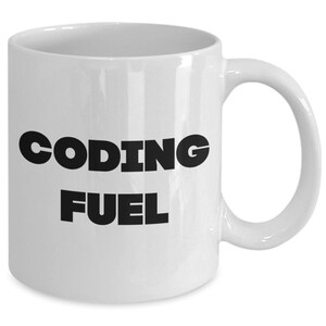 May include: White ceramic coffee mug with black text that reads "Coding Fuel".