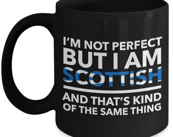 May include: Black coffee mug with white text that reads "I'm not perfect but I am Scottish and that's kind of the same thing". The text is surrounded by a white line. The Scottish flag is displayed in blue and white.