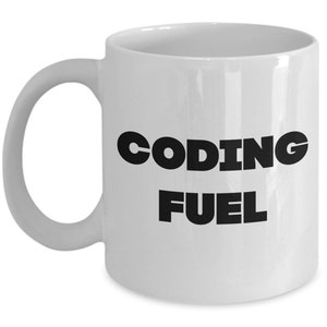 May include: White ceramic coffee mug with black text that reads "CODING FUEL".