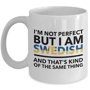 May include: White ceramic coffee mug with a black and yellow design. The mug features the text "I'm not perfect but I am Swedish and that's kind of the same thing".