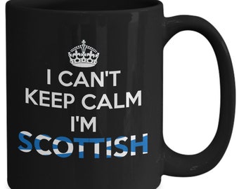 May include: Black ceramic mug with a white crown graphic and the text "I CAN'T KEEP CALM I'M SCOTTISH" in white and blue. The Scottish flag design is incorporated into the word "SCOTTISH".