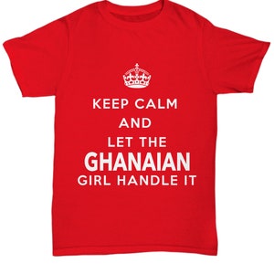 May include: Red t-shirt with white text that reads "Keep Calm and Let the Ghanaian Girl Handle It". A crown graphic is above the text.