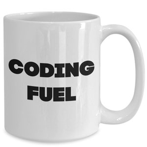 May include: White ceramic coffee mug with black text that reads "Coding Fuel".
