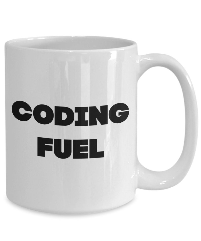 May include: White ceramic coffee mug with black text that reads "Coding Fuel".