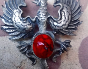 Antique brooch with eagle coat of arms with red stone