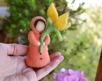 Figurine of a girl with a flower