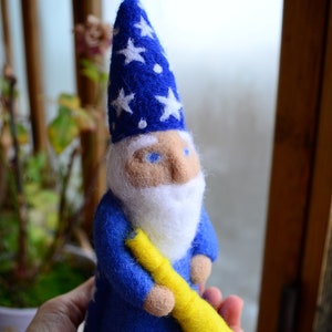 Doll Stargazer Needle felted has a cloak and a hat with stars and a Waldorf spyglass
