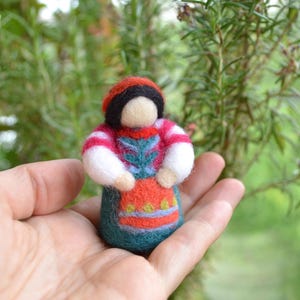 Girl in a folk costume Doll a unique amulet for your home in a dress with beautiful patterns