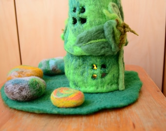 Felted house and a clearing with stones