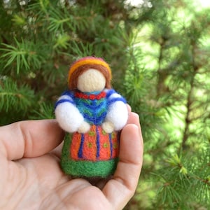Girl in a folk costume Doll a unique amulet for your home in a dress with beautiful patterns