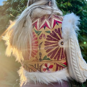 White faux fur cropped boho vest with yellow and colored antique Indian textiles for festival outfits