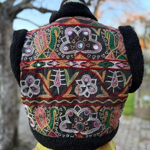 Black bohemian faux fur waistcoat with mirrored embroidery detail