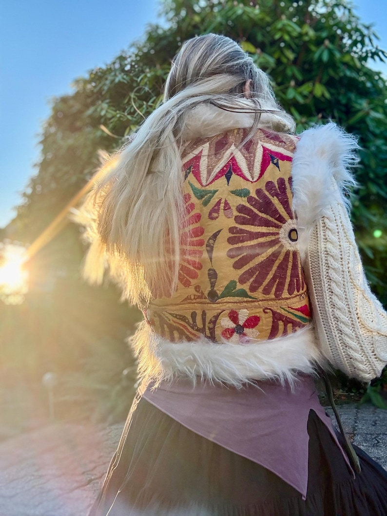 White faux fur cropped boho vest with yellow and colored antique Indian textiles for festival outfits