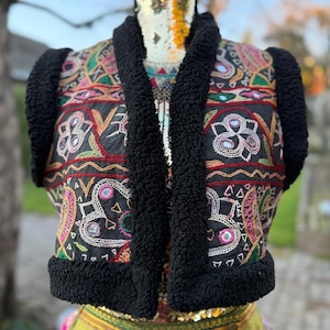 Black faux fur festival vest with vintage mirror embroidery, detail shot