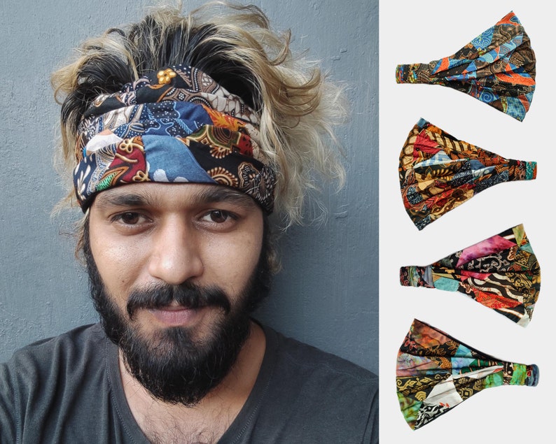 May include: A person wearing a colorful patterned headband. The headband is made of fabric and has a patchwork design. The headband is tied around the person's head and covers their forehead.