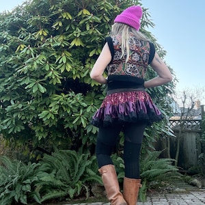 One of a kind black faux fur vest with antique Indian textile embroidery, back view