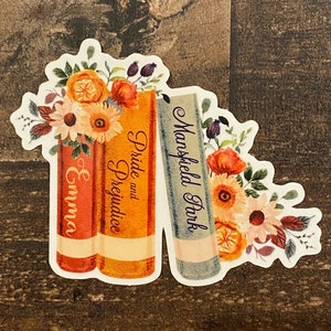 May include: A sticker featuring three books with floral illustrations. The books are titled "Pride and Prejudice", "Emma", and "Mansfield Park".